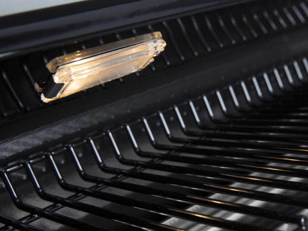 Grill light on Broil King Regal series grill illuminating cast iron cooking grates