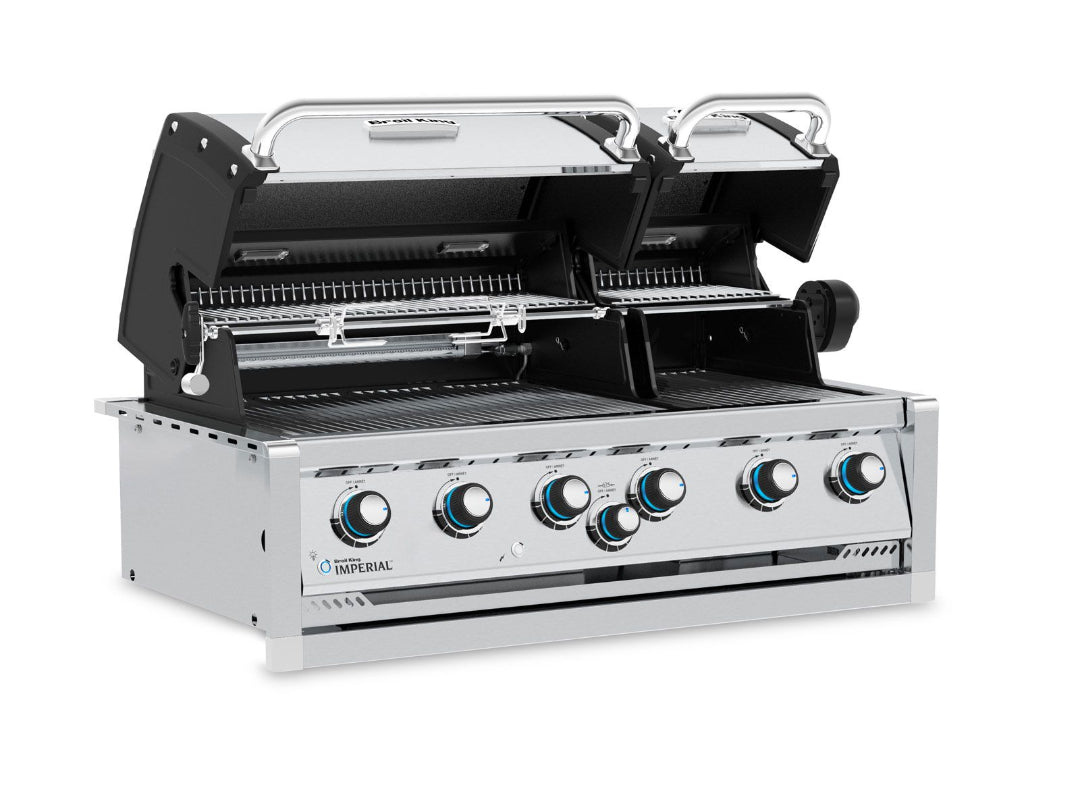 Broil King Imperial built-in dual hood gas grill with rotisserie and illuminated control knobs.