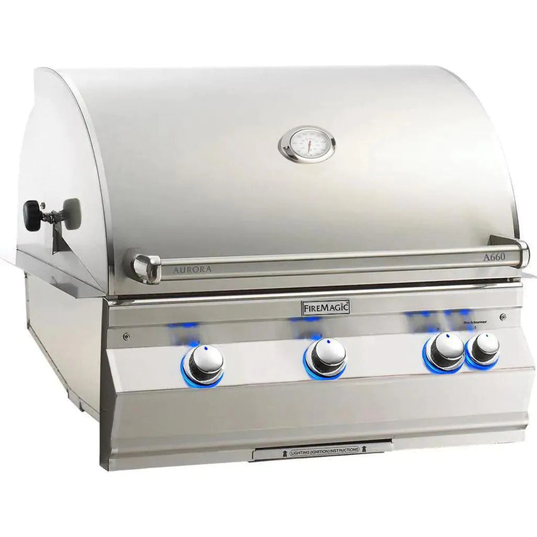 FireMagic Aurora A660i built-in stainless steel gas grill for outdoor kitchen, four-burner with hood thermometer and blue LED-lit control knobs