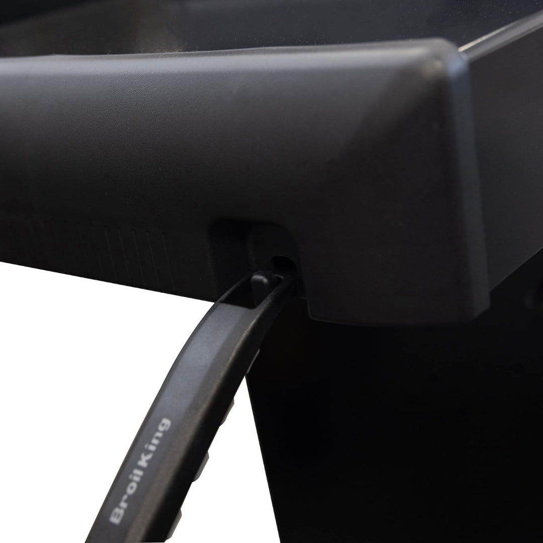 Grill tool hook, Broil King, Crown Series, utensil hanging from right side shelf slot – close-up accessory view