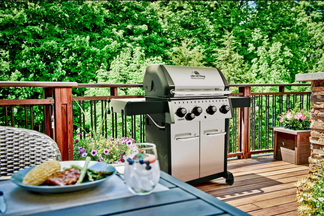 Freestanding Grill – Broil King – Crown Series – Stainless Steel Grill on Patio Deck with Outdoor Dining Table