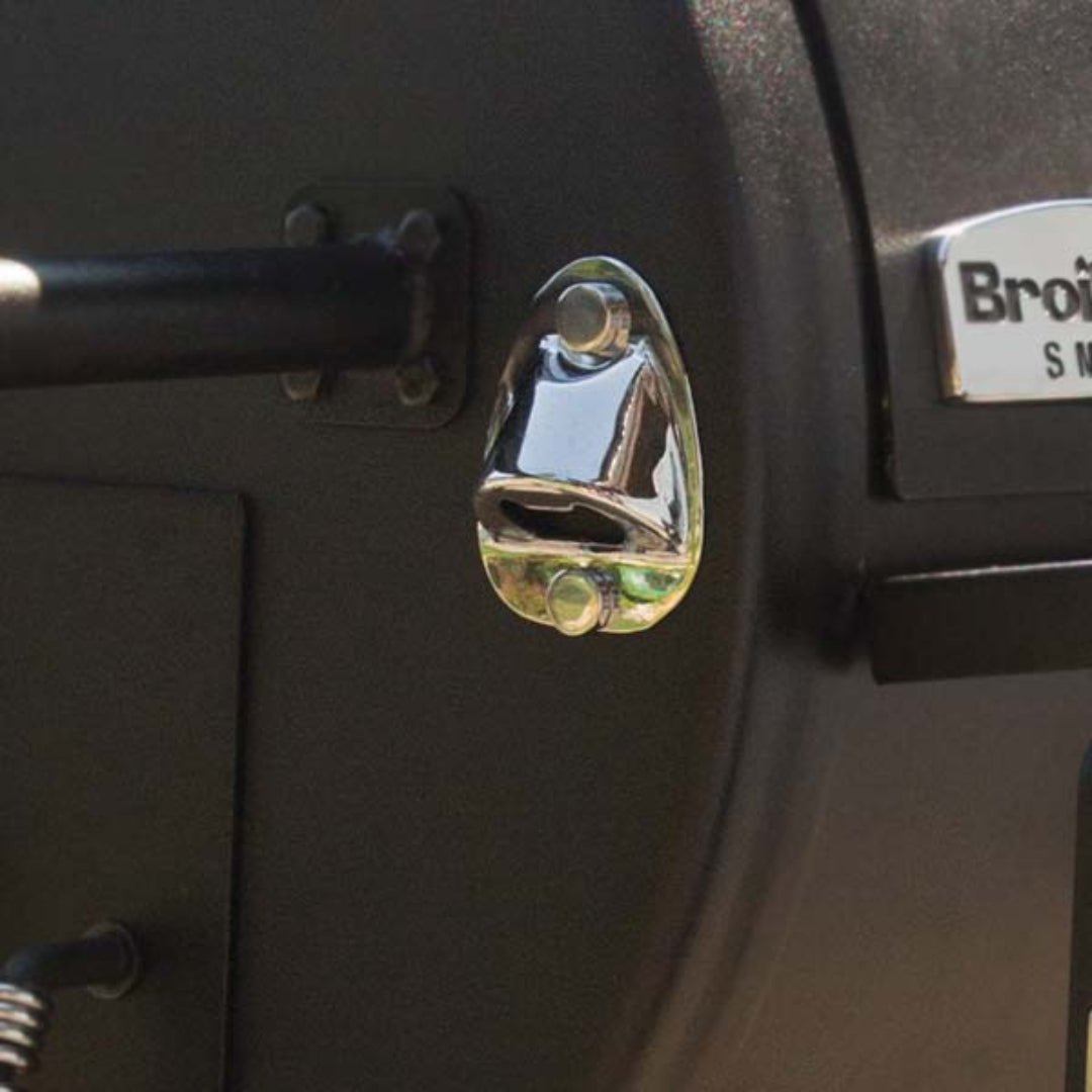 Accessory, Broil King, built-in bottle opener, stainless steel, mounted on smoker body near handle