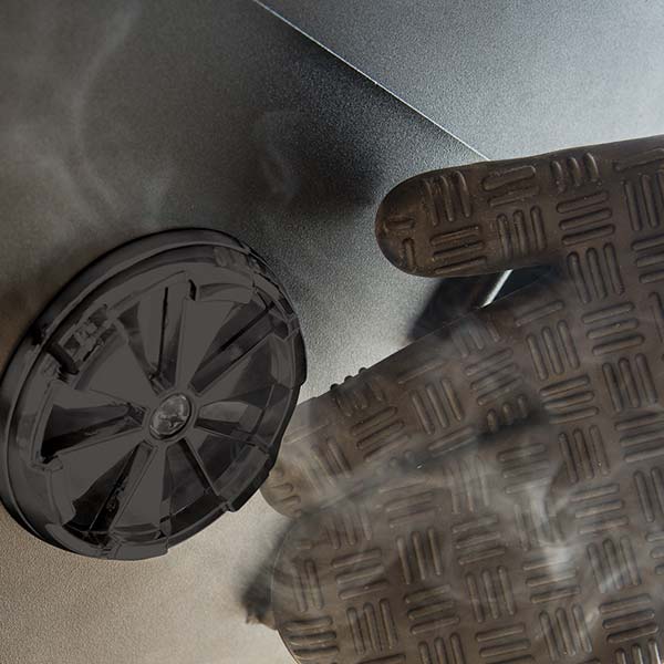 Broil King Vertical Gas Smoker Side Vent Detail with Smoke, Gloved Hand Adjusting Damper