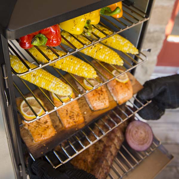 Cabinet smoker, Broil King, Smoke series, grilling corn, peppers, salmon, and ribs on multiple cooking racks