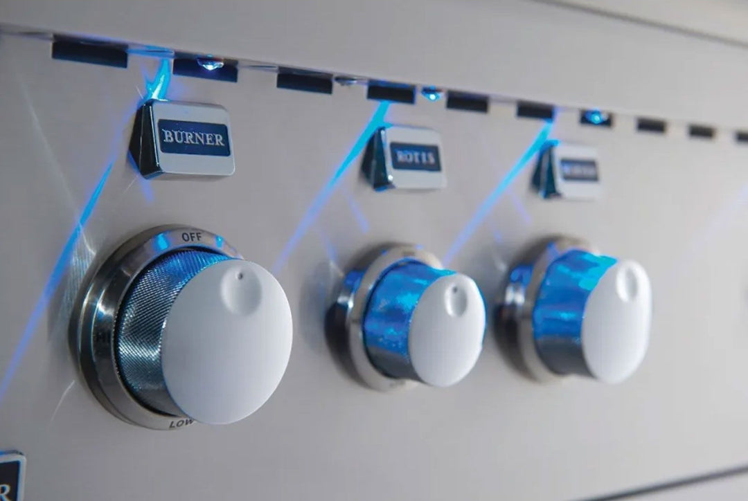 Broilmaster BSG424N 42-inch 4-burner built-in stainless steel natural gas grill control knobs close-up with blue LED backlighting