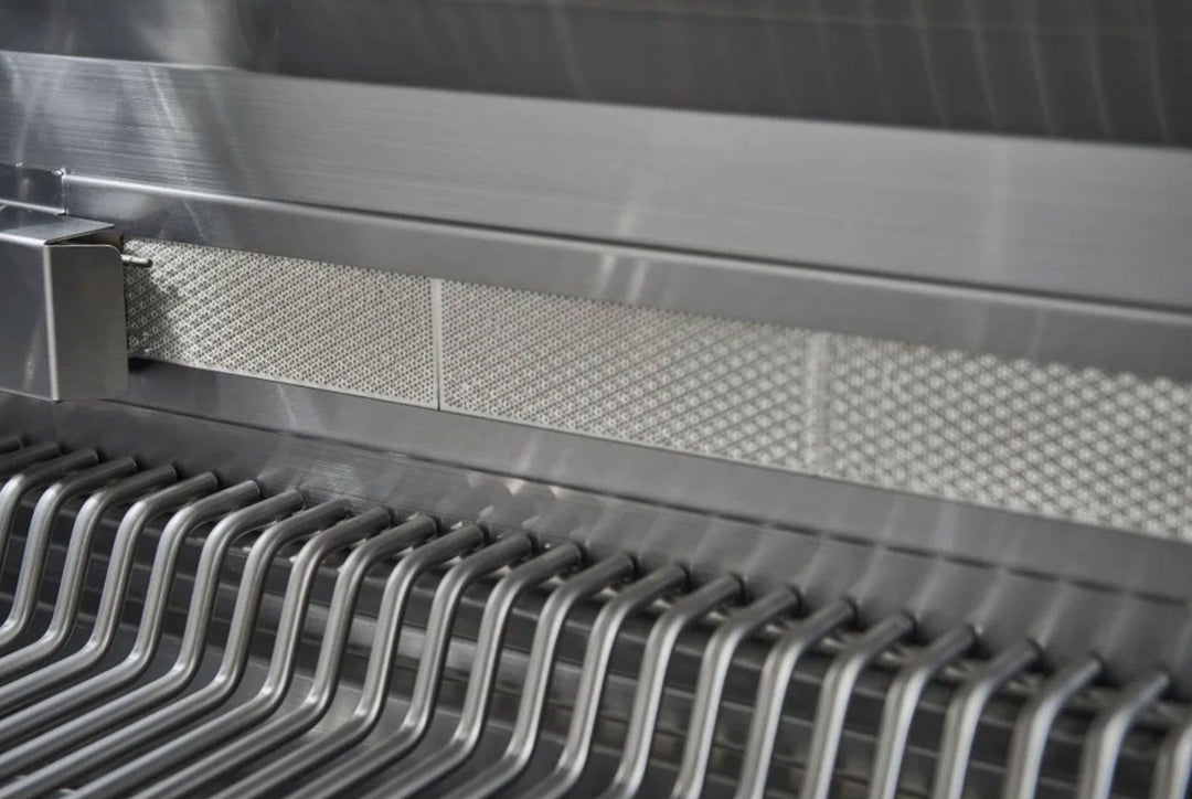 Broilmaster BSB405P 40-inch B-Series 5-burner stainless propane gas grill interior close-up showing stainless steel cooking grates and perforated heat baffles