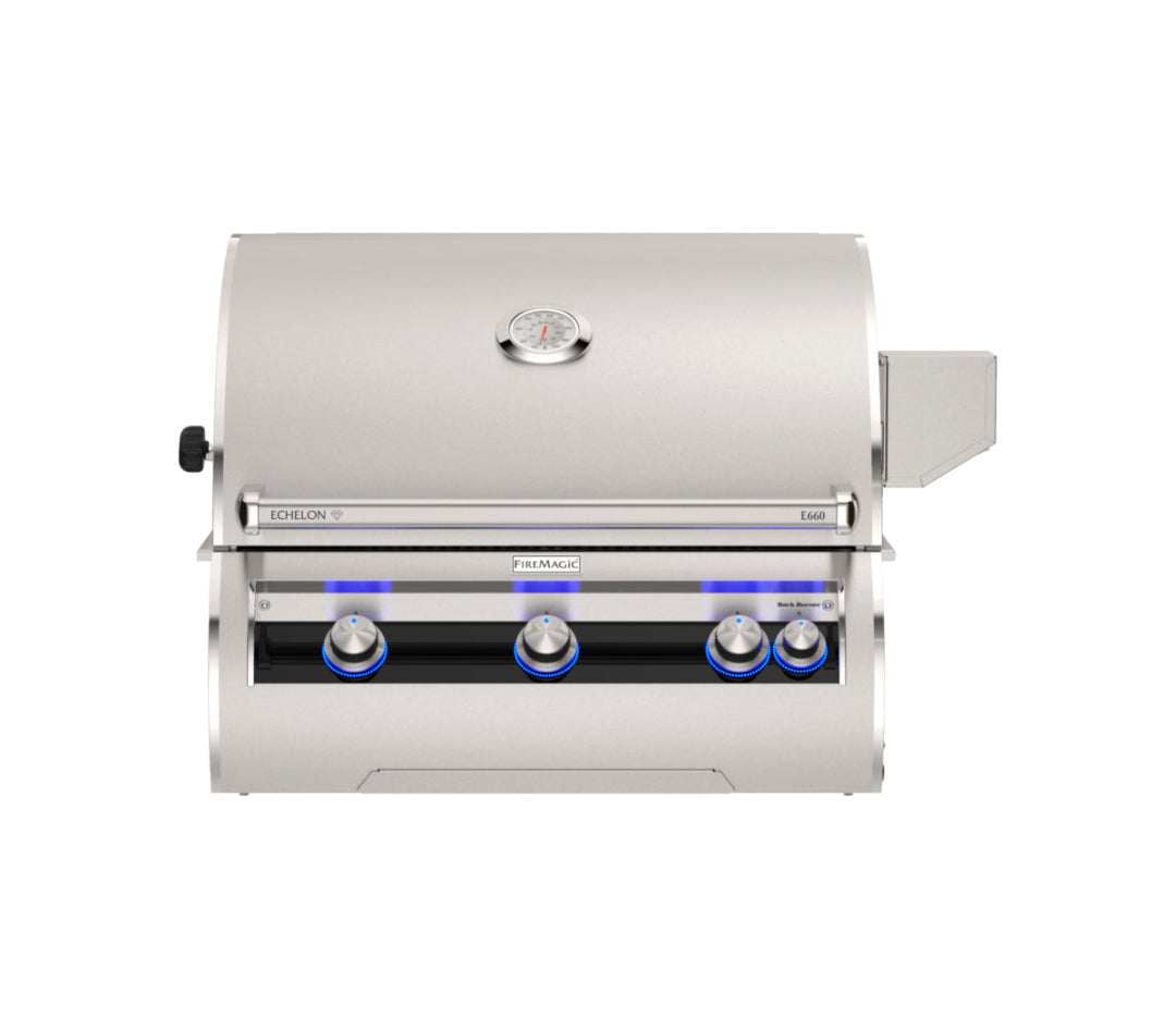 FireMagic Echelon E660i built-in stainless steel gas grill front view closed hood analog thermometer blue LED control knobs 3 main burners plus back burner