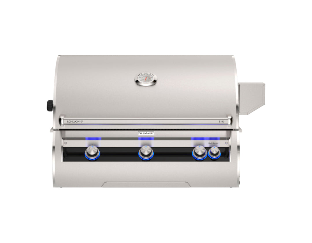 Fire Magic Echelon E790i built-in stainless steel gas grill front view with closed hood, analog lid thermometer and blue LED illuminated control knobs