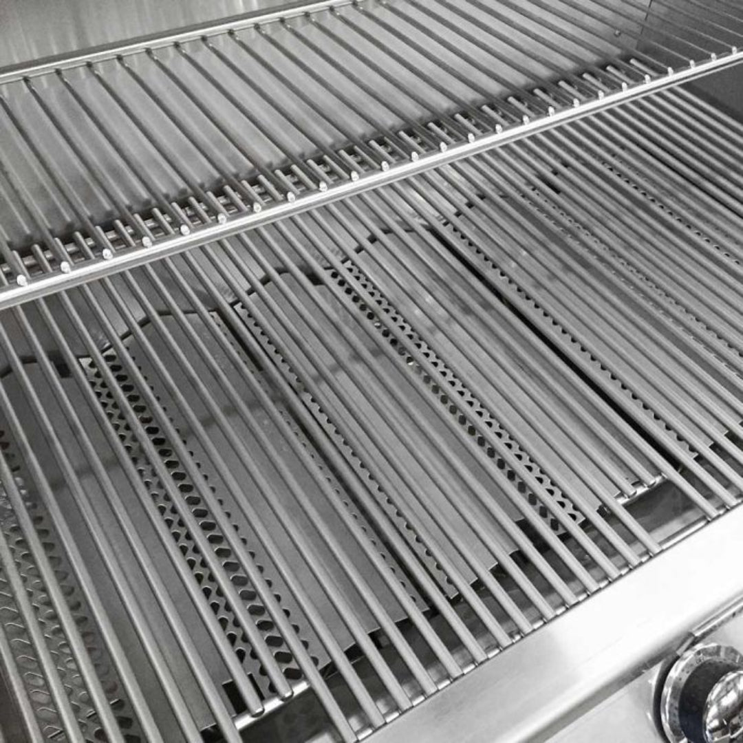 Fire Magic Legacy Deluxe 30-inch built-in natural gas grill S1S1N-A interior close-up showing stainless steel rod cooking grates, sear plates and burner tubes