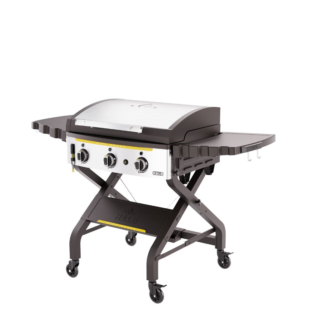 HALO Elite 3B Griddle HZ-1002-XNA three-burner outdoor griddle with stainless steel lid, side shelves, swing-away warming rack and locking casters