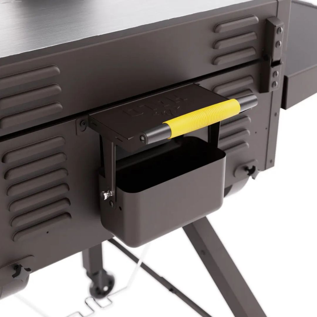 HALO Elite 3B Griddle HZ-1002-XNA close-up of rear grease trough with swing-out squeegee handle (yellow grip) and locking caster