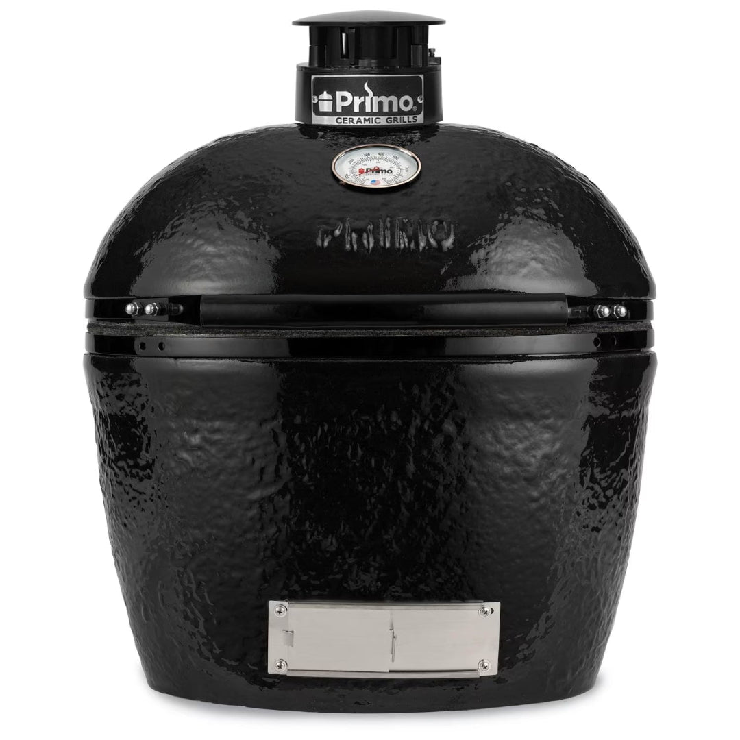 Primo black ceramic kamado grill front view — oval kamado-style charcoal BBQ with top vent cap, built-in analog lid thermometer and stainless steel ash/draft door