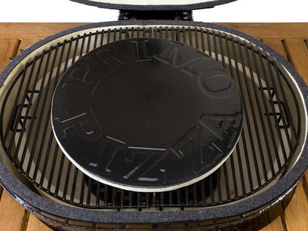 Primo 15-inch glazed ceramic pizza baking stone with embossed PRIMO logo on kamado grill grate