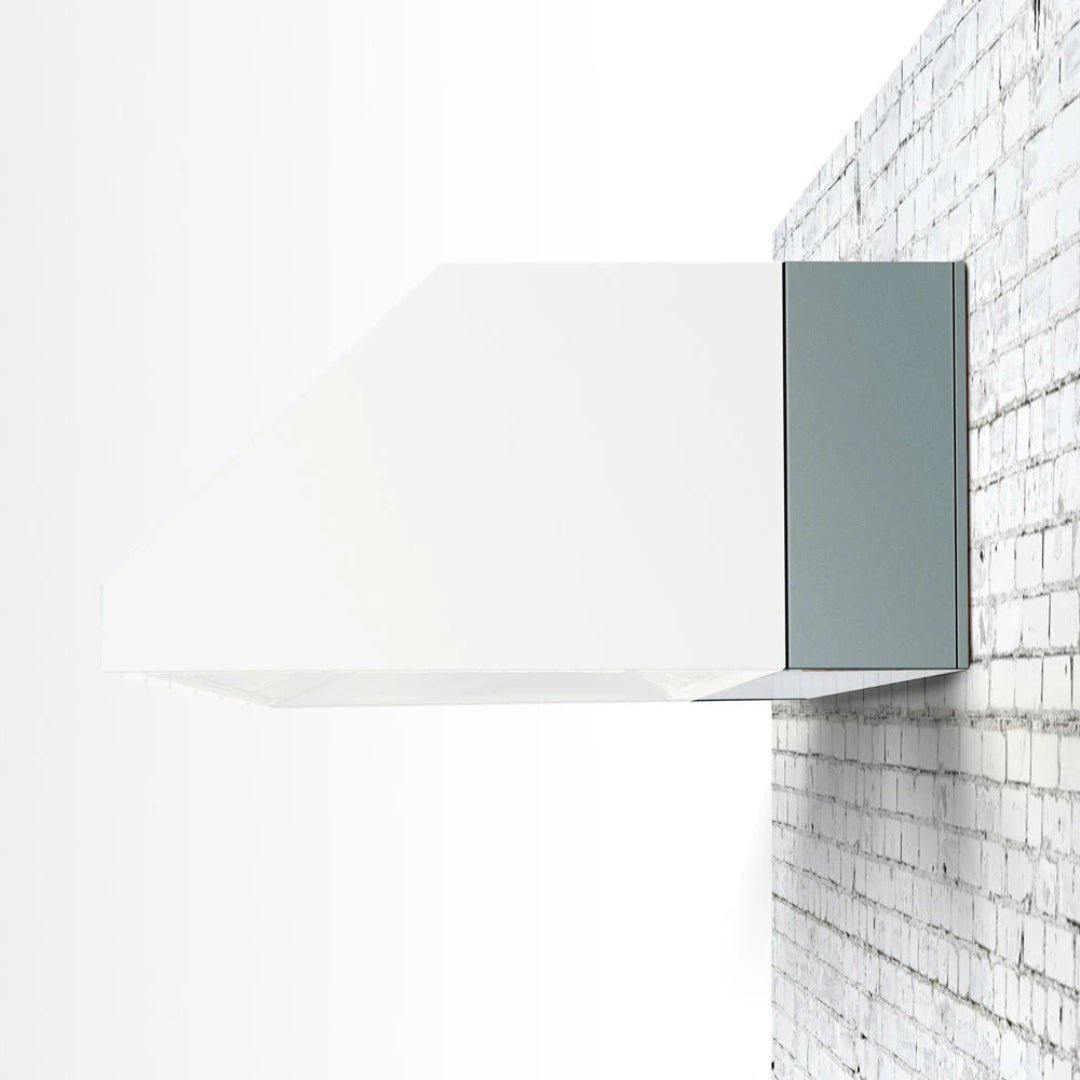 Vine & Flame TF-VH48 48-inch white modern wall-mounted range hood with angled canopy, glass underside and gray stainless side chimney — ducted kitchen vent hood on white brick wall