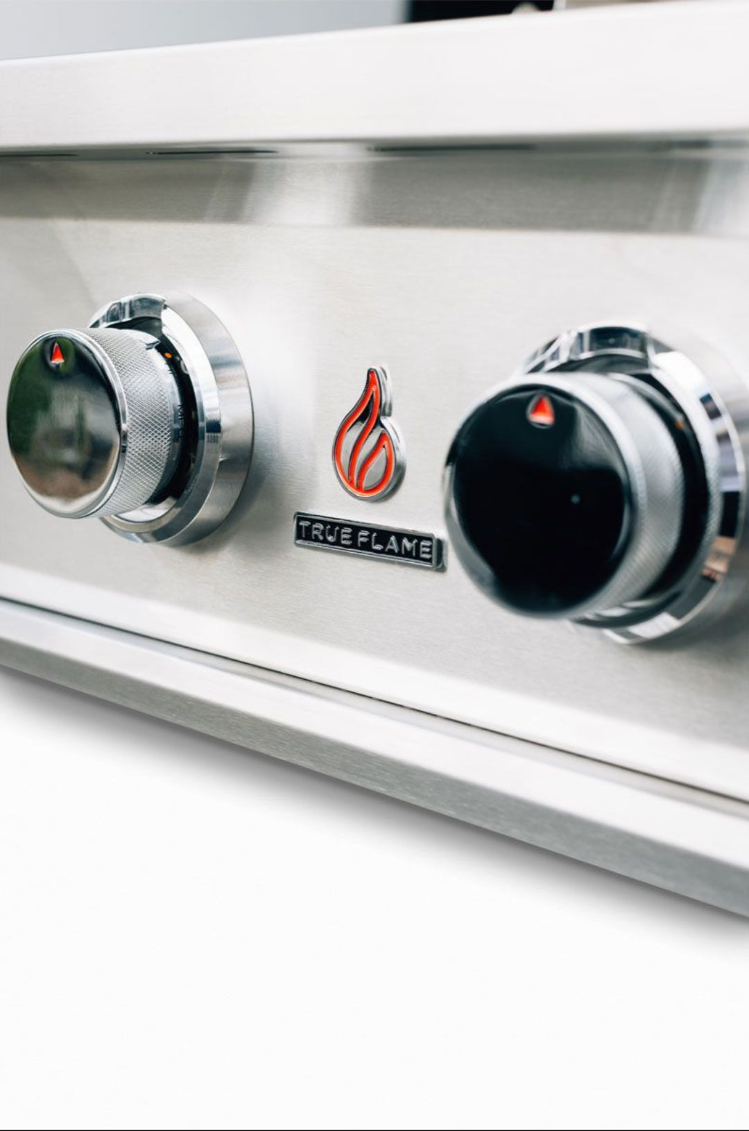 True Flame TFE25-NG3 25-inch 3-burner built-in natural gas grill stainless steel control panel close-up showing knobs and True Flame logo