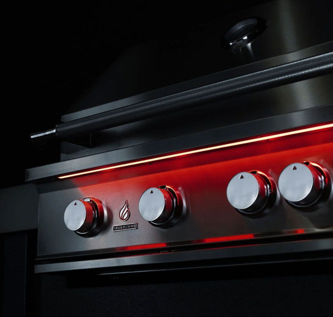 TrueFlame TF32-NG 32-inch 4-burner built-in natural gas outdoor kitchen grill control panel close-up stainless steel knobs red LED accent lighting