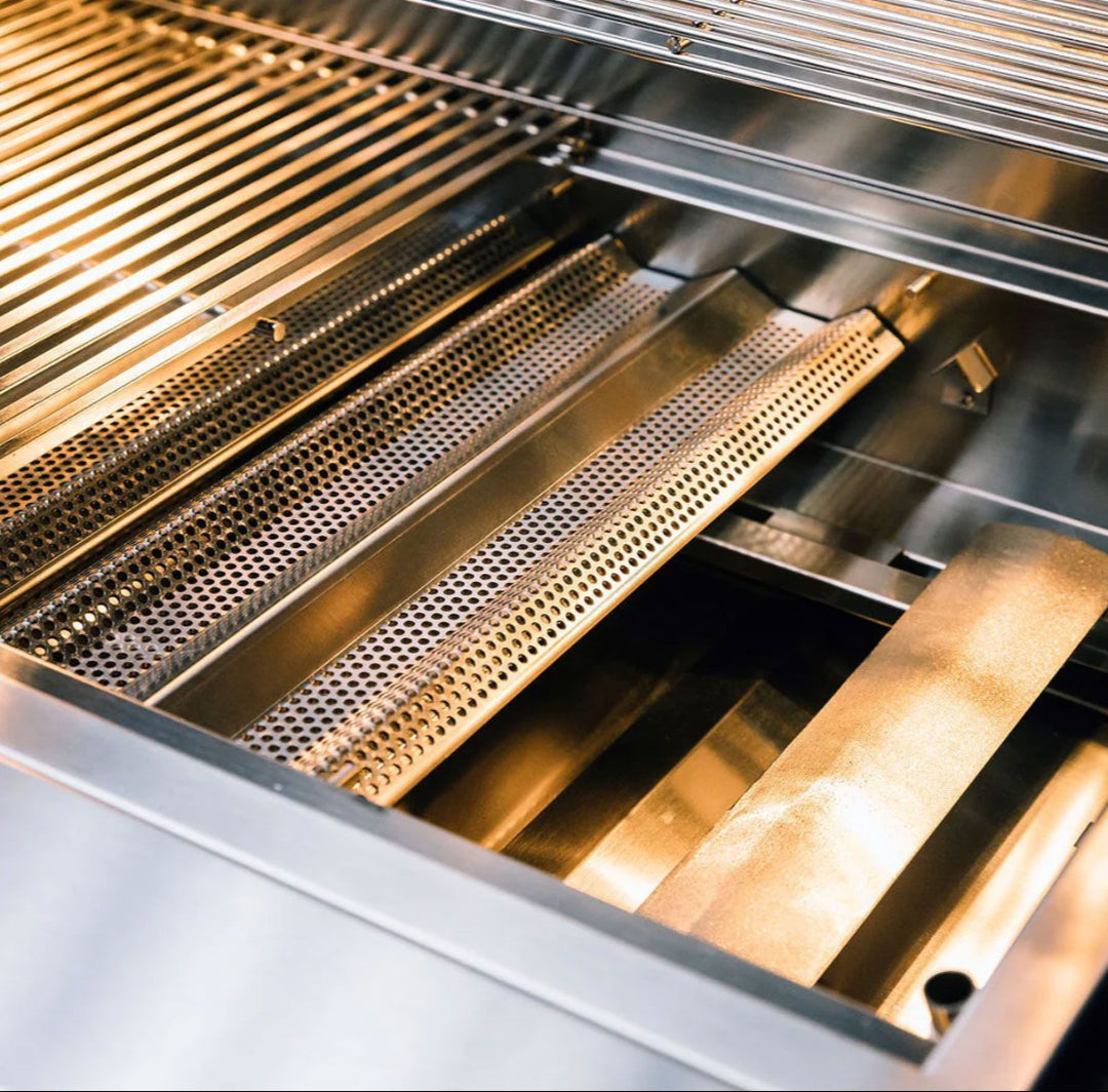 Close-up interior of TrueFlame TF40-LP 40-inch 5-burner built-in propane gas grill showing stainless steel cooking grates, perforated heat tents/flavorizer bars, burners and grease drip tray