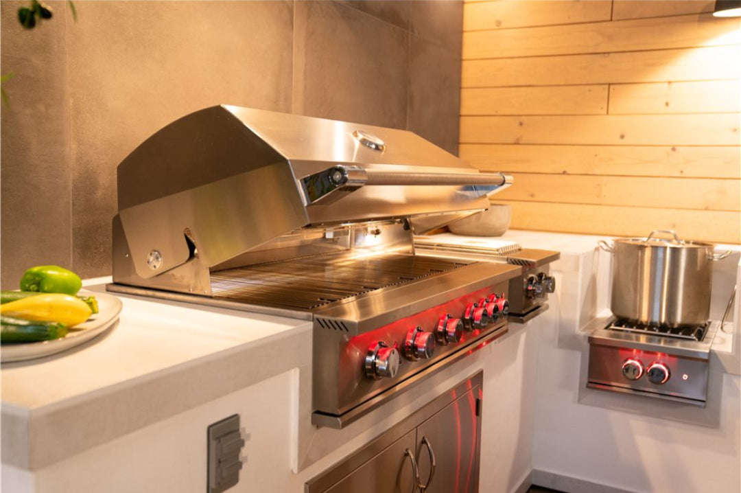 TrueFlame TF40-LP 40-inch 5-burner built-in stainless steel propane gas grill with open hood, red-lit control knobs, integrated side burner and storage cabinet in outdoor kitchen