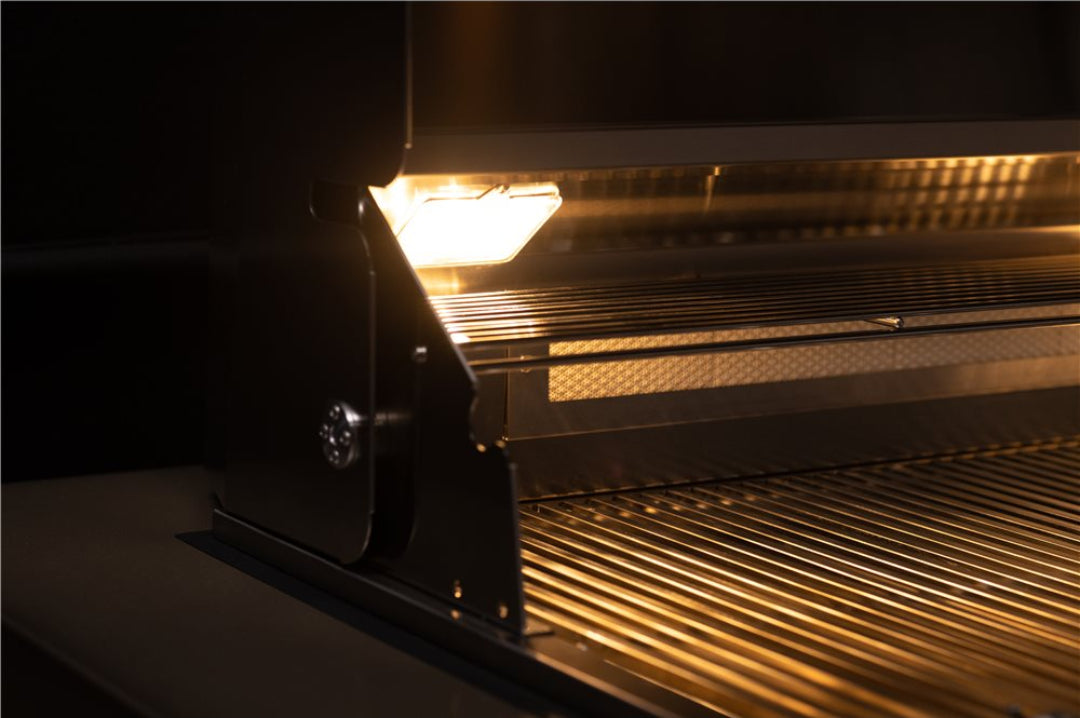 TrueFlame TF40-LP 40-inch 5-burner built-in propane grill close-up of stainless-steel grates, warming rack and hood light