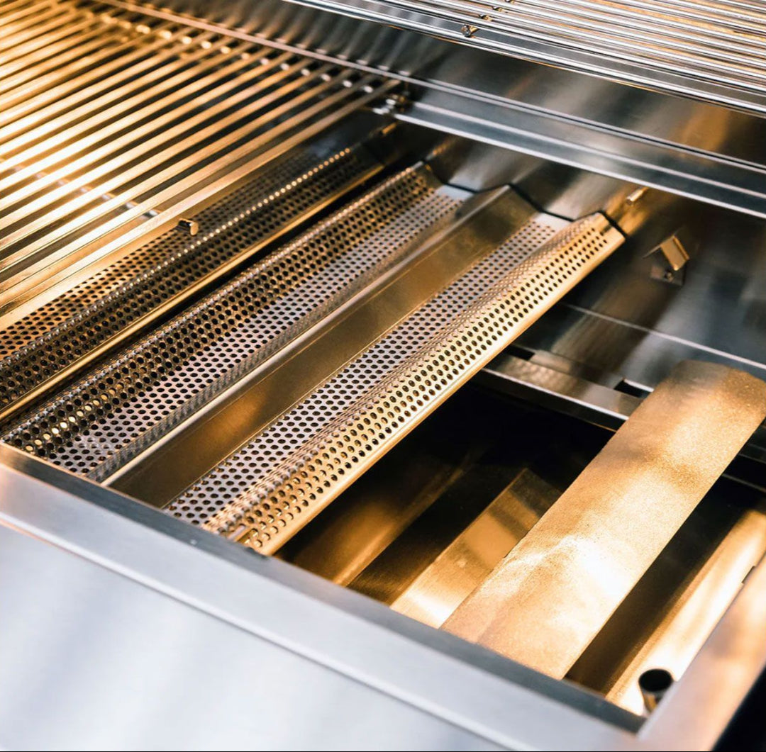TrueFlame TF Series TF25-NG7 25-inch 3-burner built-in natural gas grill interior close-up showing stainless steel cooking grates, perforated flame tamers and burners