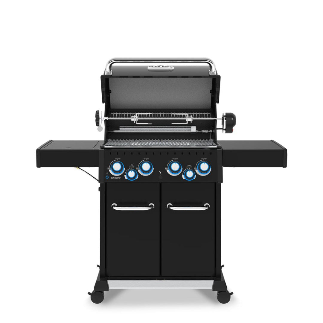 Freestanding grill, Broil King, Baron series, propane gas grill with lid open and rotisserie system visible