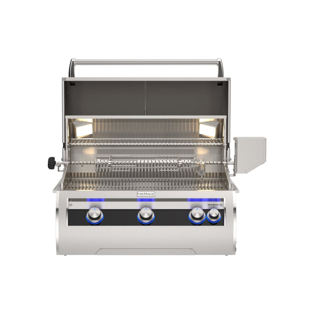 FireMagic Echelon FM-E660i built-in stainless steel gas grill with open hood, warming rack, rotisserie, interior lights and blue LED illuminated analog control knobs