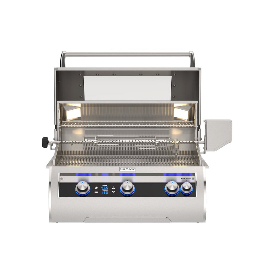 Fire Magic Echelon FM-E660i built-in stainless steel gas grill with open hood, digital control panel and blue LED knobs, rotisserie, interior lights and two-tier warming rack