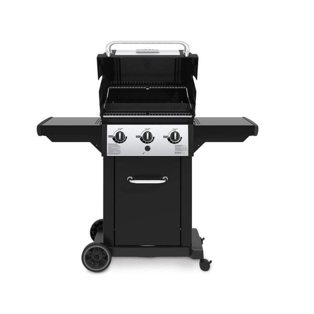Freestanding grill, Broil King, 3-burner, lid open, warming rack visible, side shelves folded down